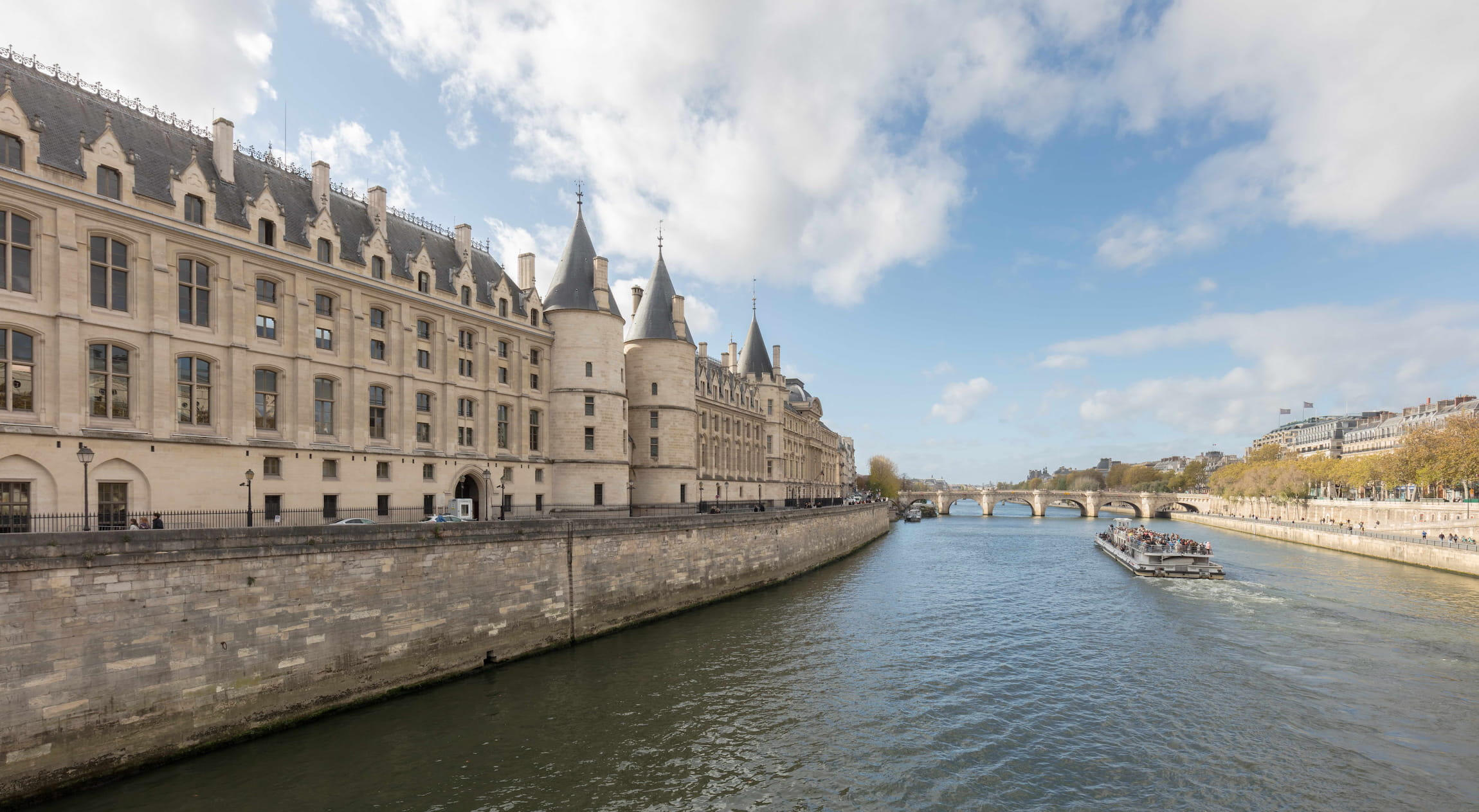 View of the Conciergerie along the Seine River, representing French legal practice.